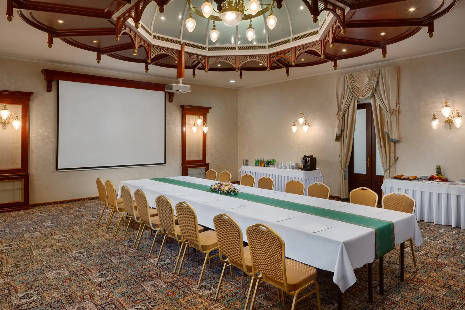 Edward's Library at Hotel Nové Lázně — a conference table between bookshelves